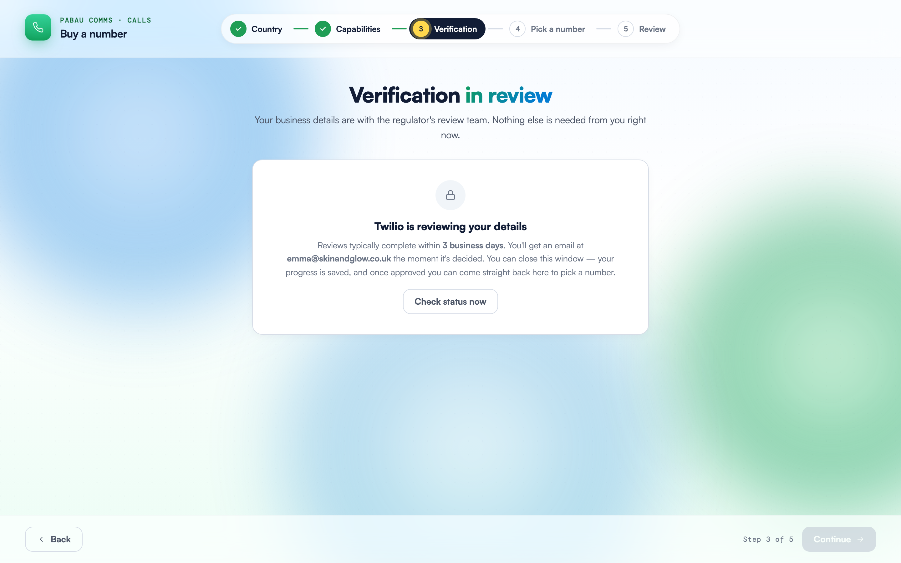 The Verification step in its pending state, with the Twilio is reviewing your details panel and the Check status now button