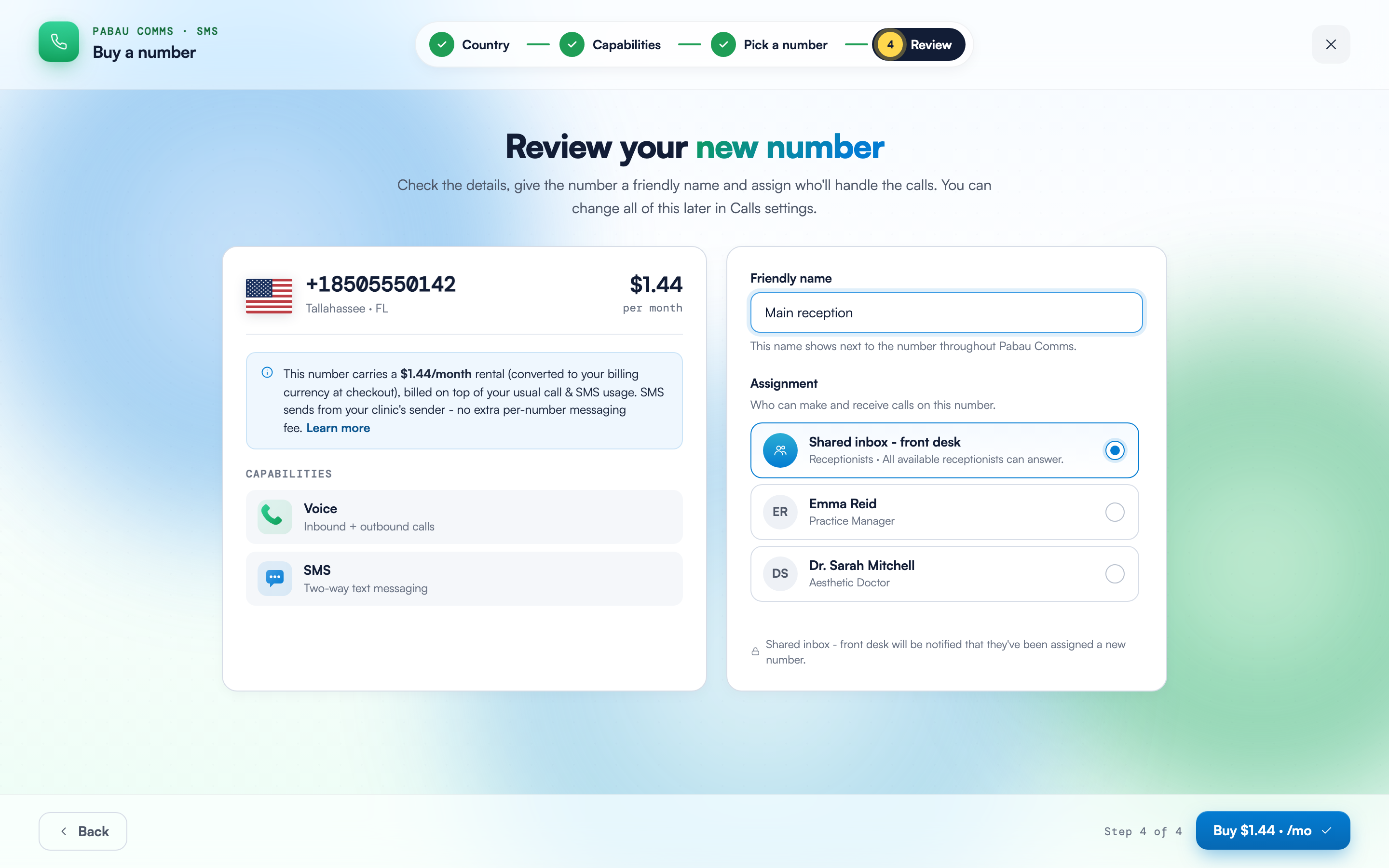 The Review step showing the selected number with its monthly rental banner, Voice and SMS capabilities, a Friendly name field and the Assignment options